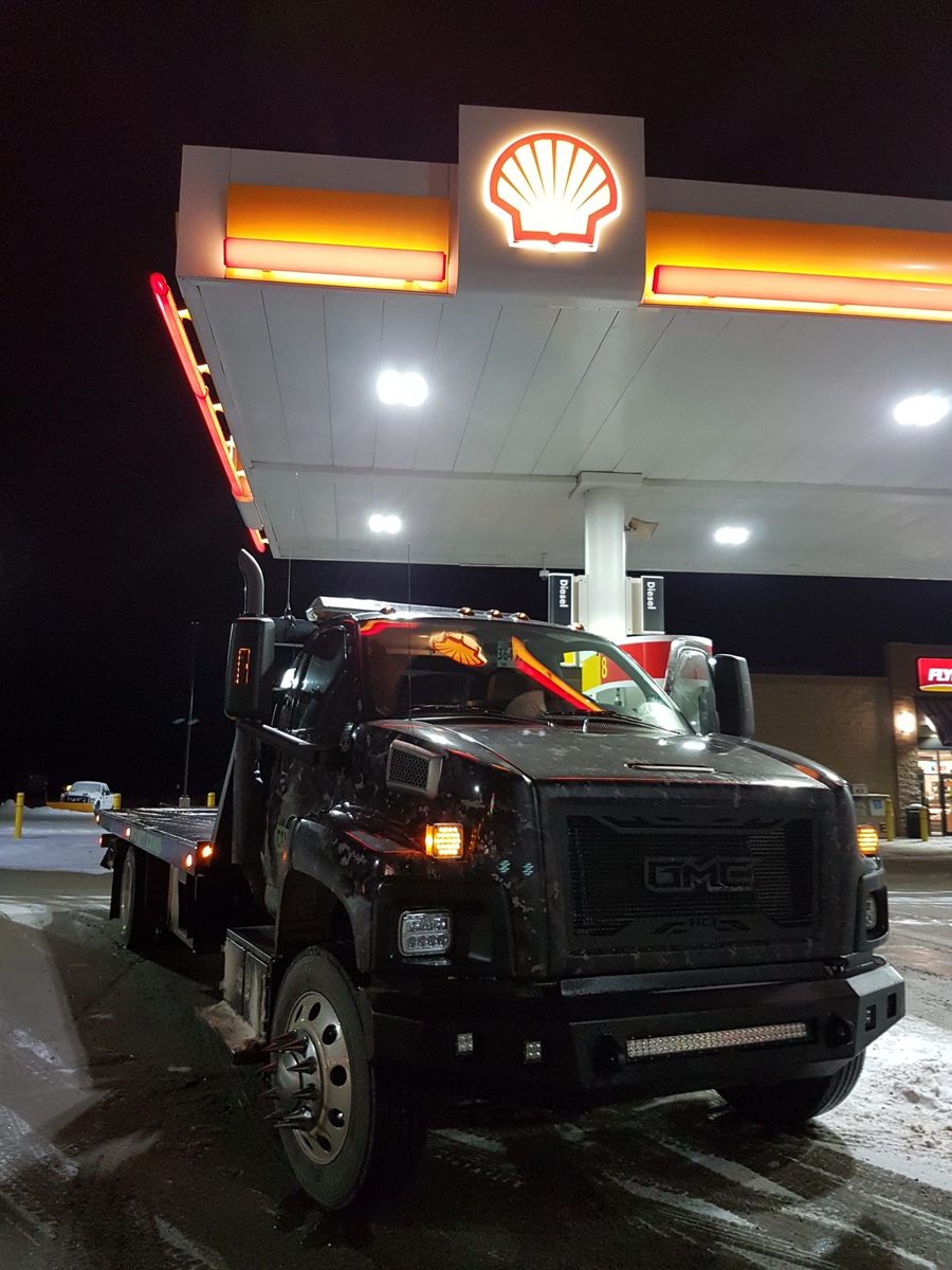 Camo Tow truck at night